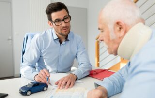 A Lawyer Talking With His Injured Client