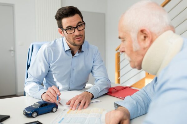 A Lawyer Talking With His Injured Client