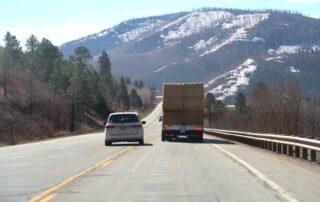 Car Overtaking A Truck On A Road