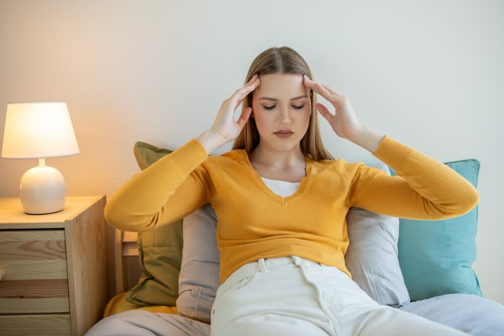 A photo of a woman experiencing emotional distress.