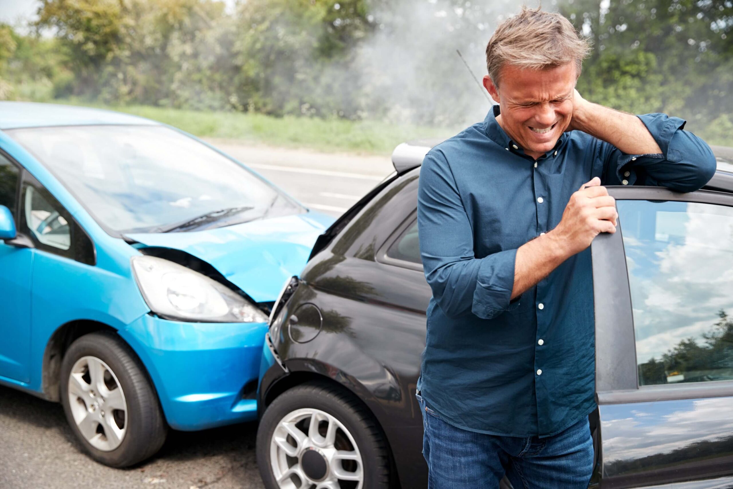 Man holding his neck after a car accident